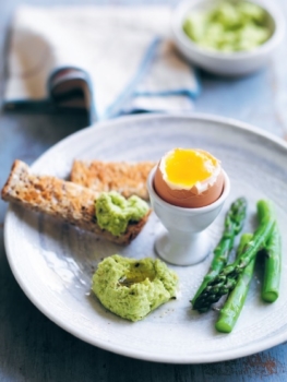 Boiled egg with green dippers